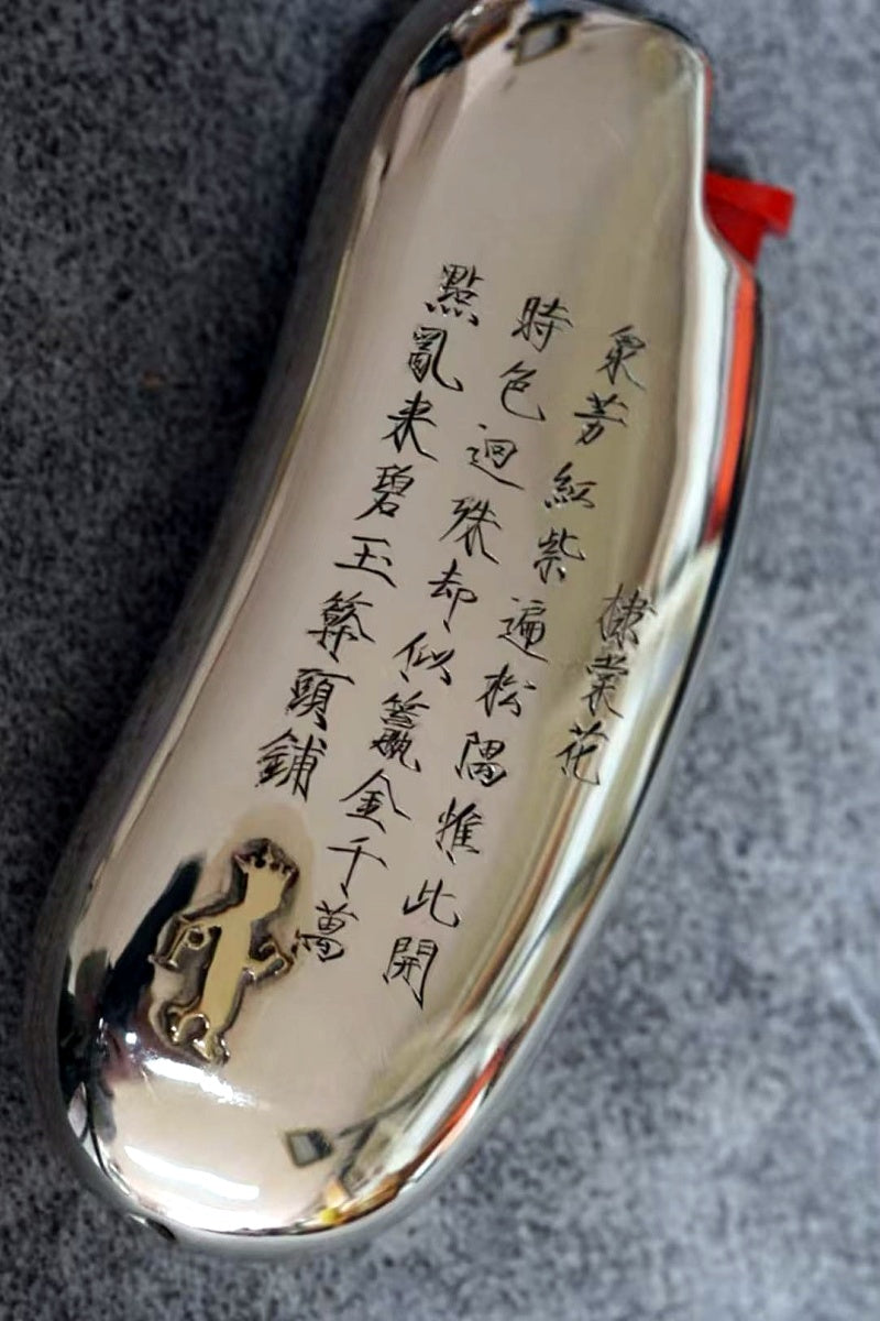 Pure silver lighter with a gold emblem