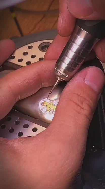 Pure silver lighter with a gold emblem